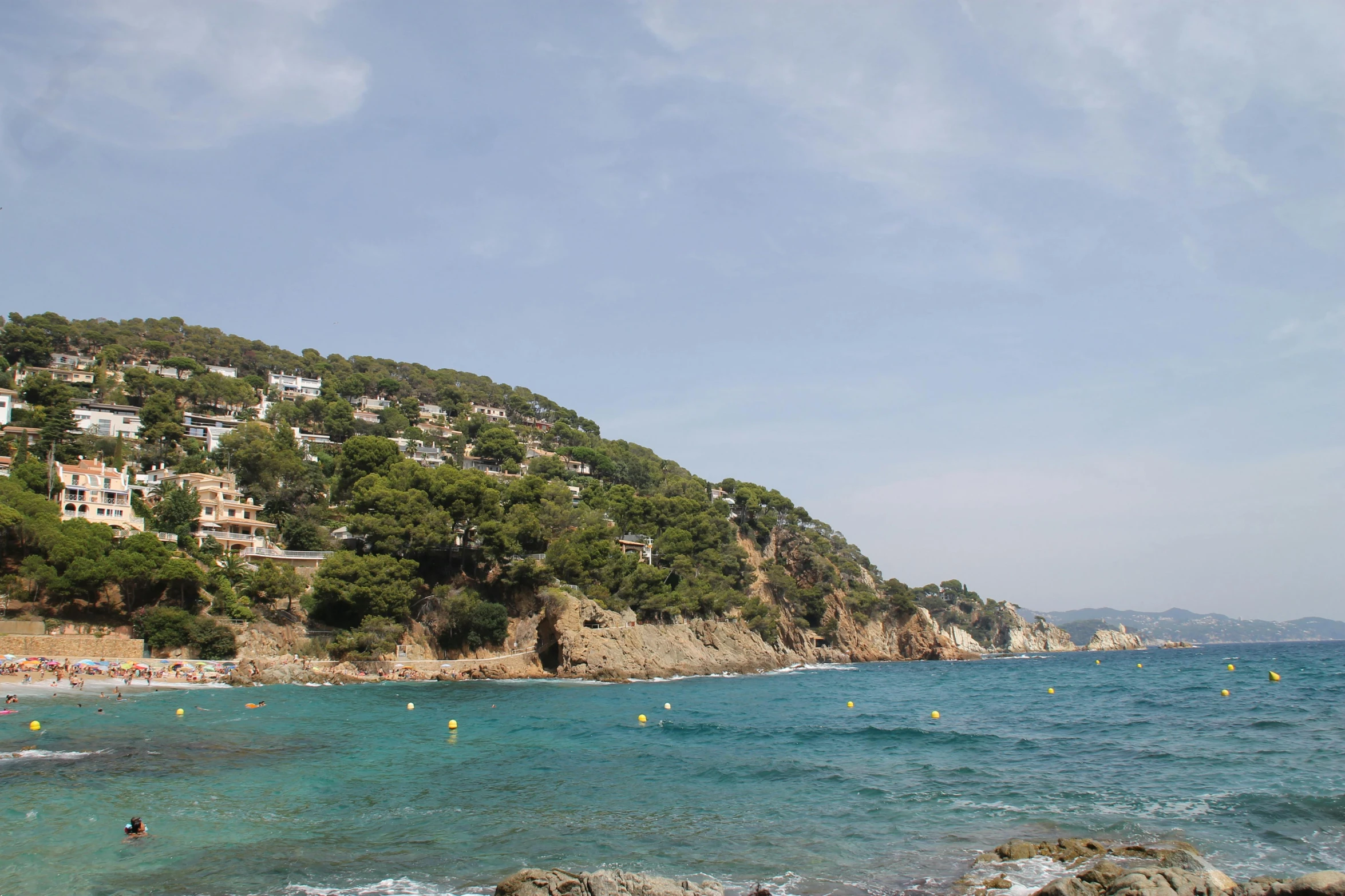 people enjoy a day at the ocean with swimmers