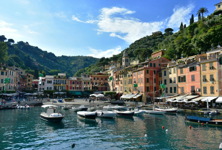 boats are sitting in the harbor with buildings