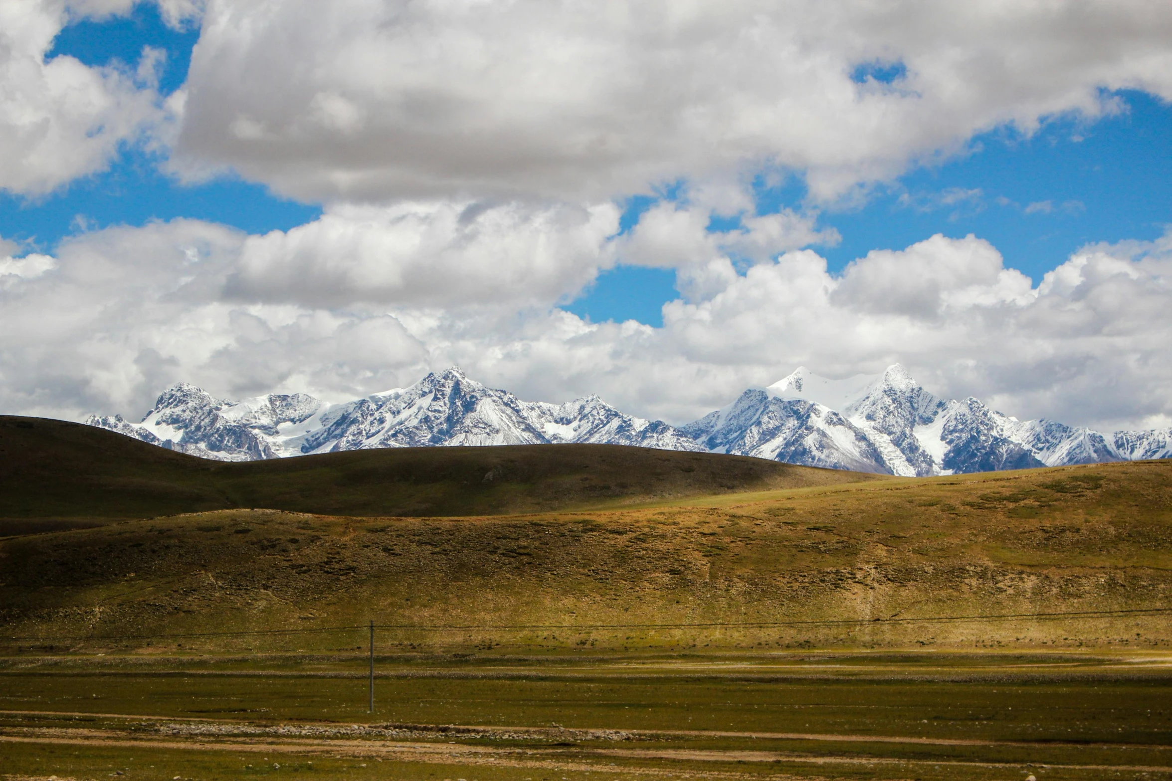 the snow covered mountains are visible in the distance