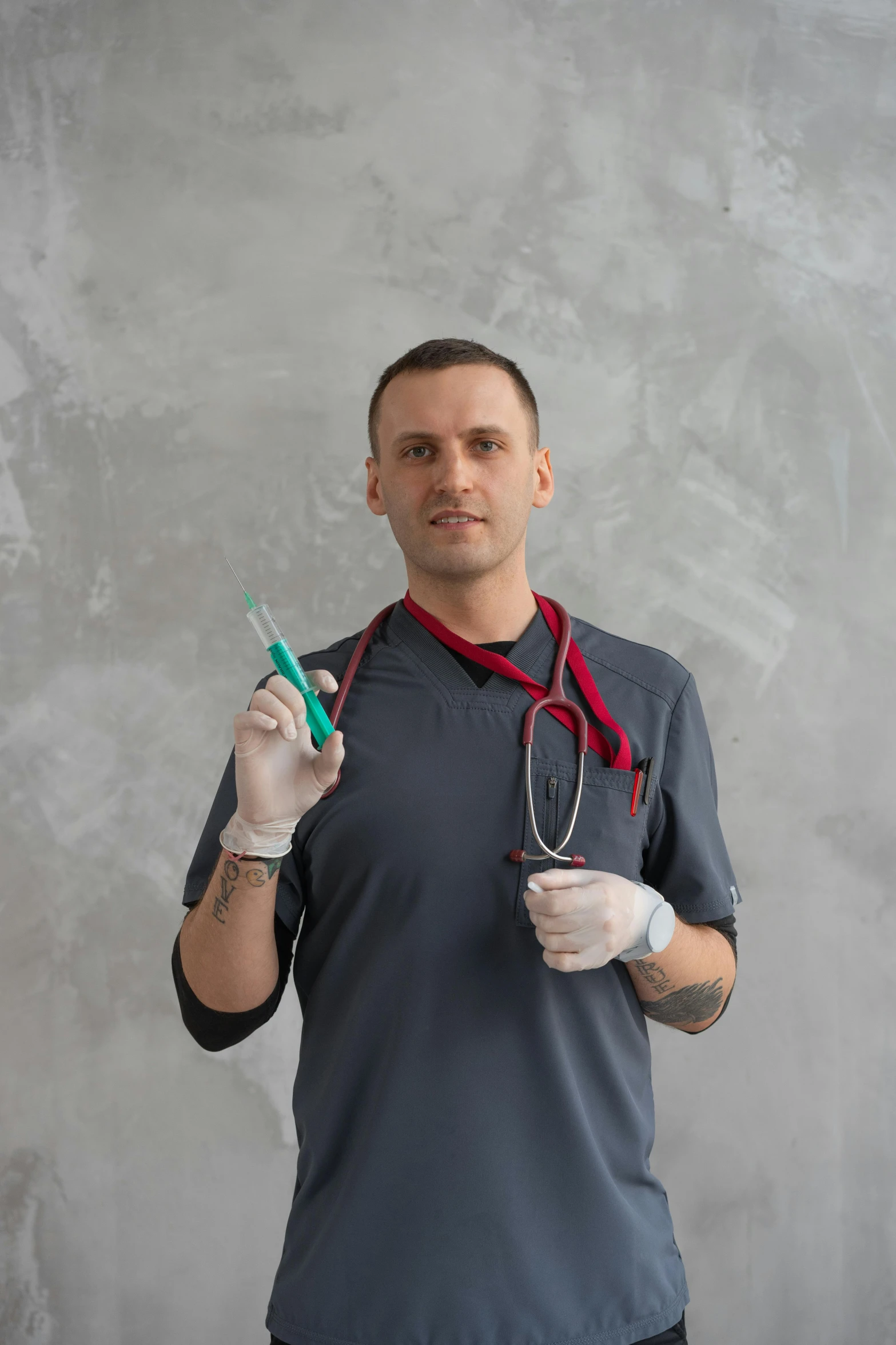 a male in a black shirt and some scissors