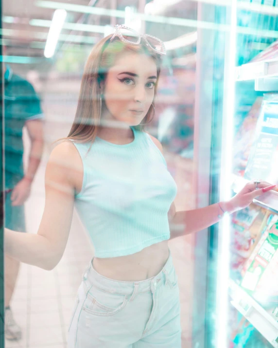 a woman standing in front of a frozen machine