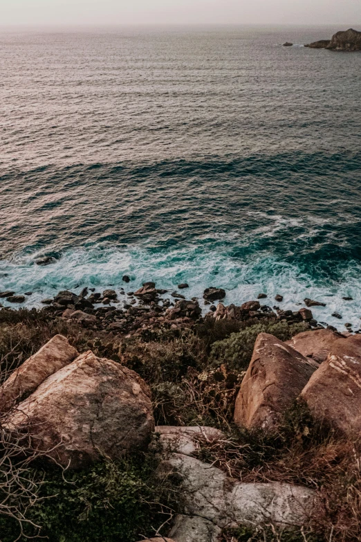 an ocean view with rocky shoreline and some water