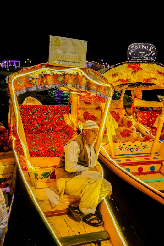 some boats sitting with some people and some lights