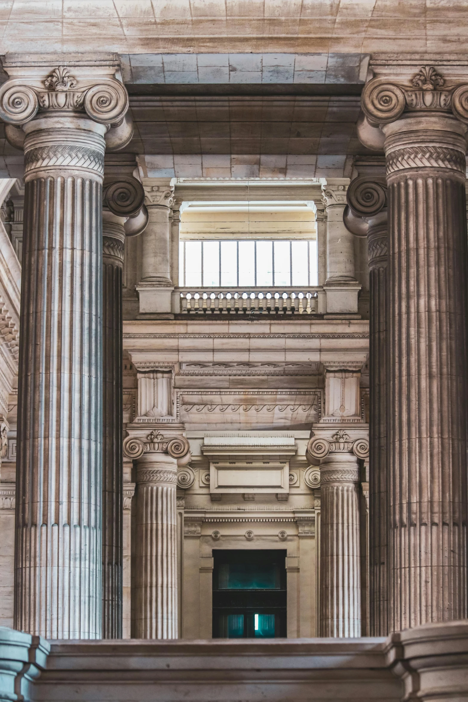 the ceiling is covered with intricate columns and a light in the window