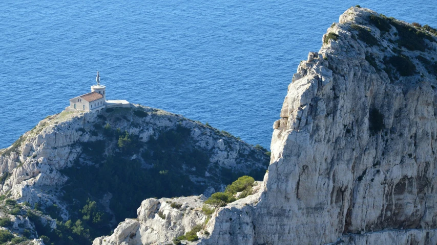 a lighthouse that is sitting on a cliff