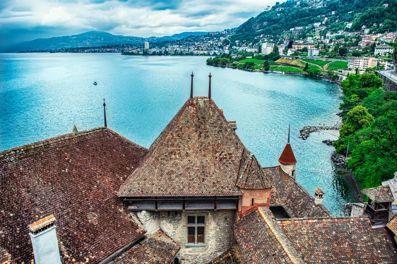 looking down at roofs on the side of an old church by the water