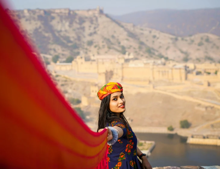 a woman is taking a picture in an historical area