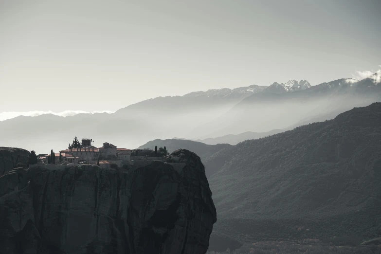 the castle stands on the edge of the mountain