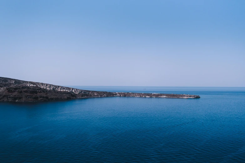 blue waters and cliffs surround a body of water