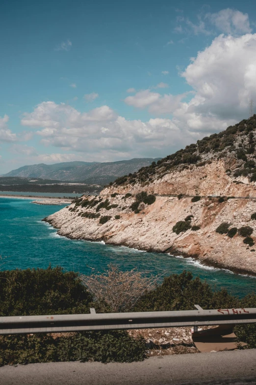 a highway runs through a beautiful green landscape