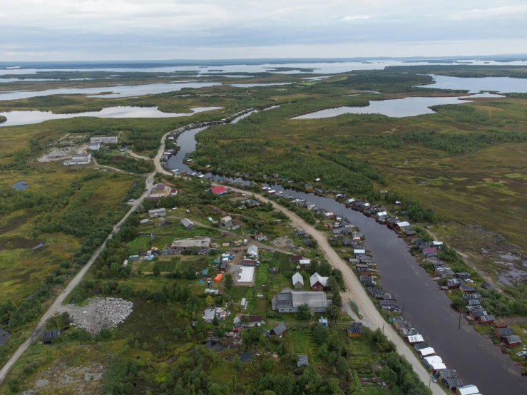 an aerial view of small town near the water