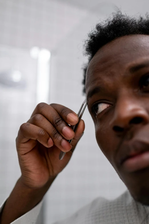 the woman is posing with her nose close to the camera