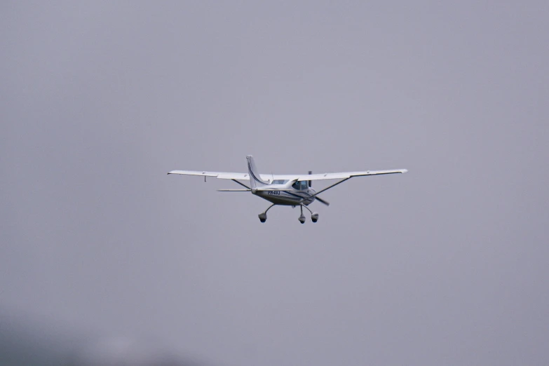 a single engine plane flying in the air