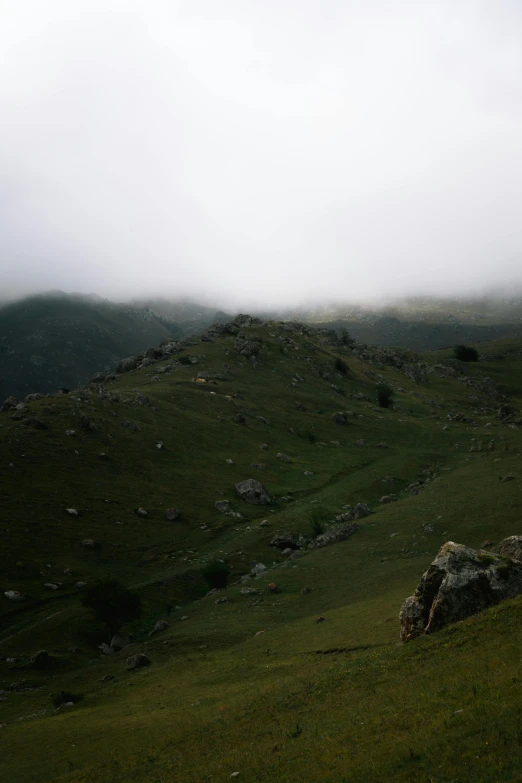 a hill with grassy hillside in the middle of it