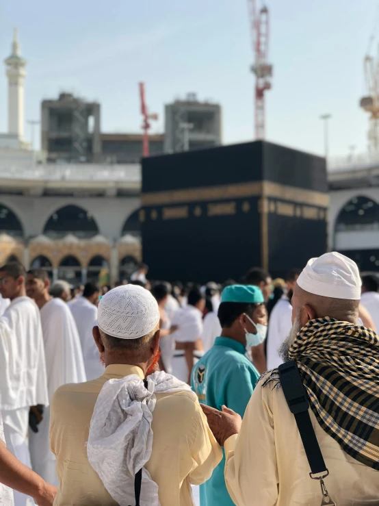 a group of people in white and blue