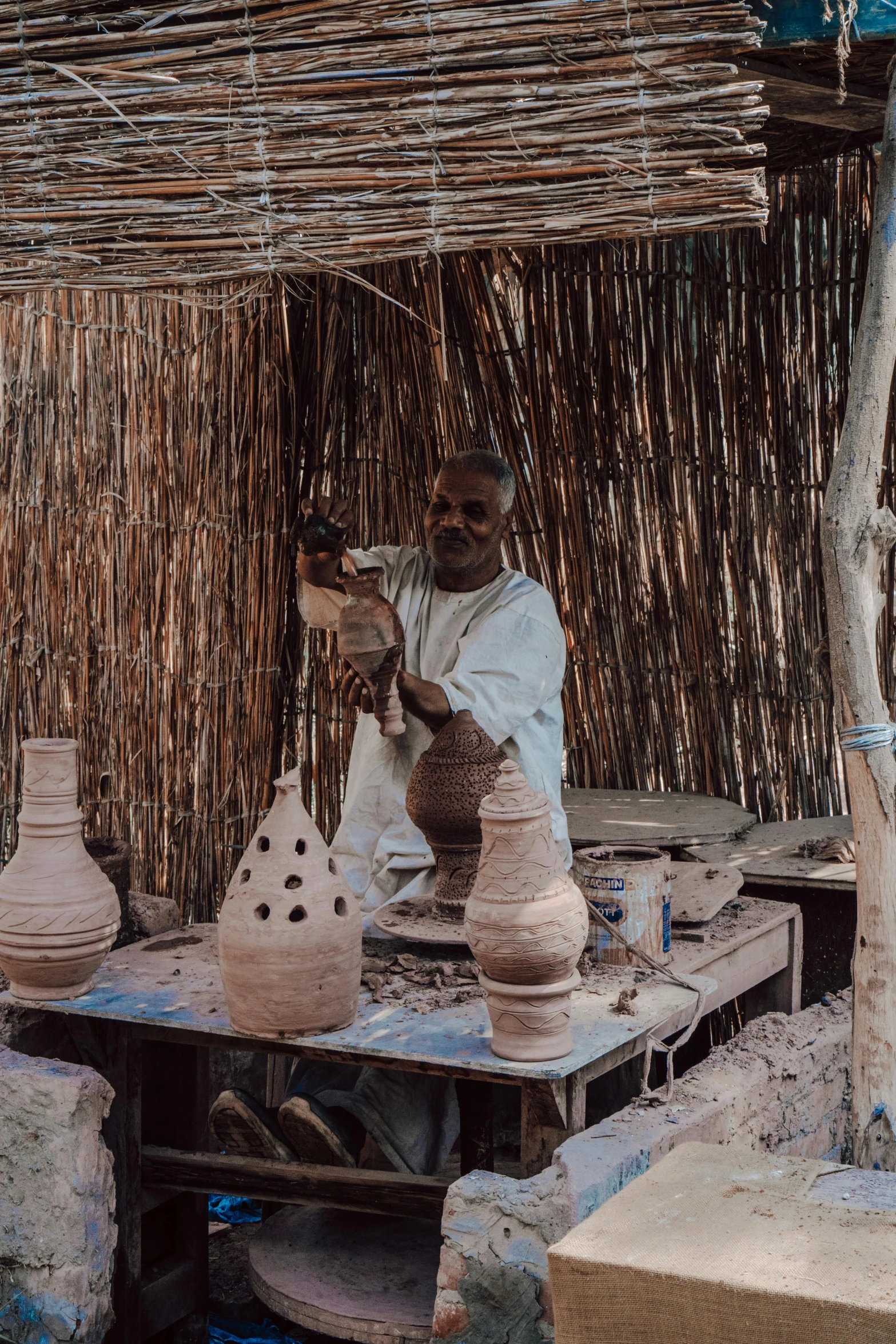 a person is working on some clay pottery