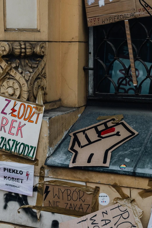 signs posted on the front wall of a building in paris