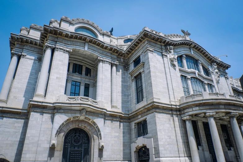 large white building with several doors and multiple windows