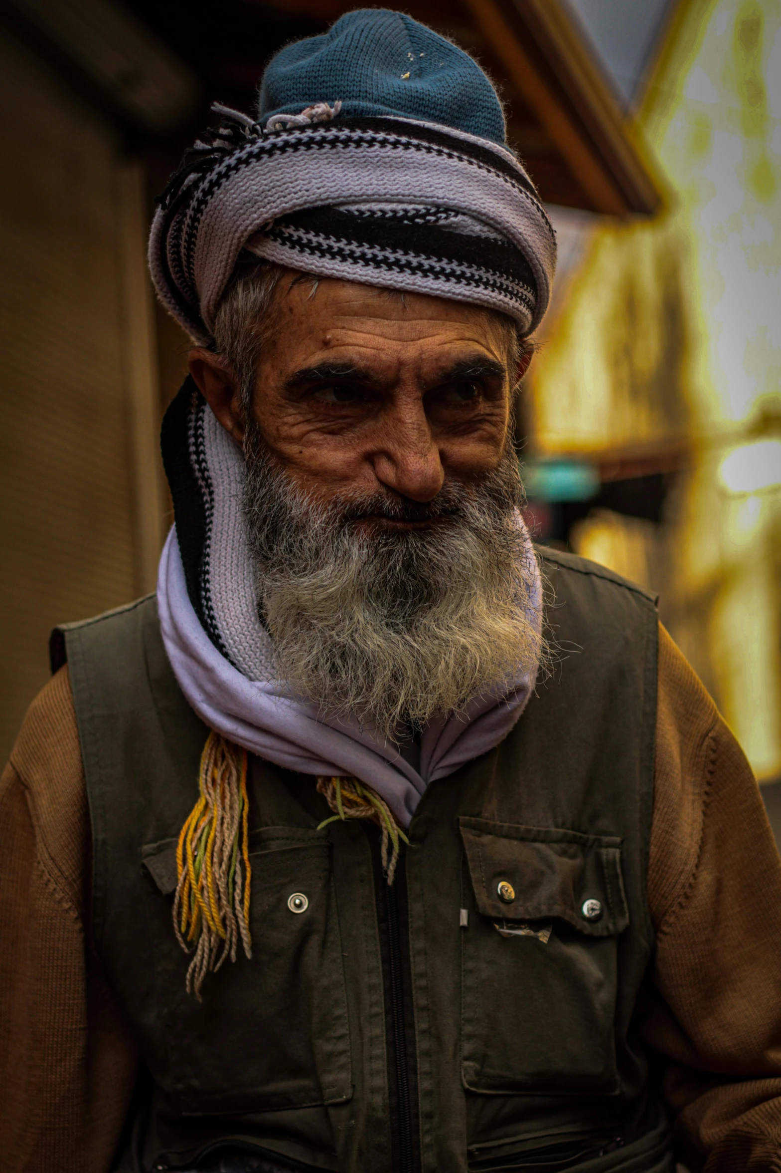 the older man with a beard and no mustache is posing for the camera