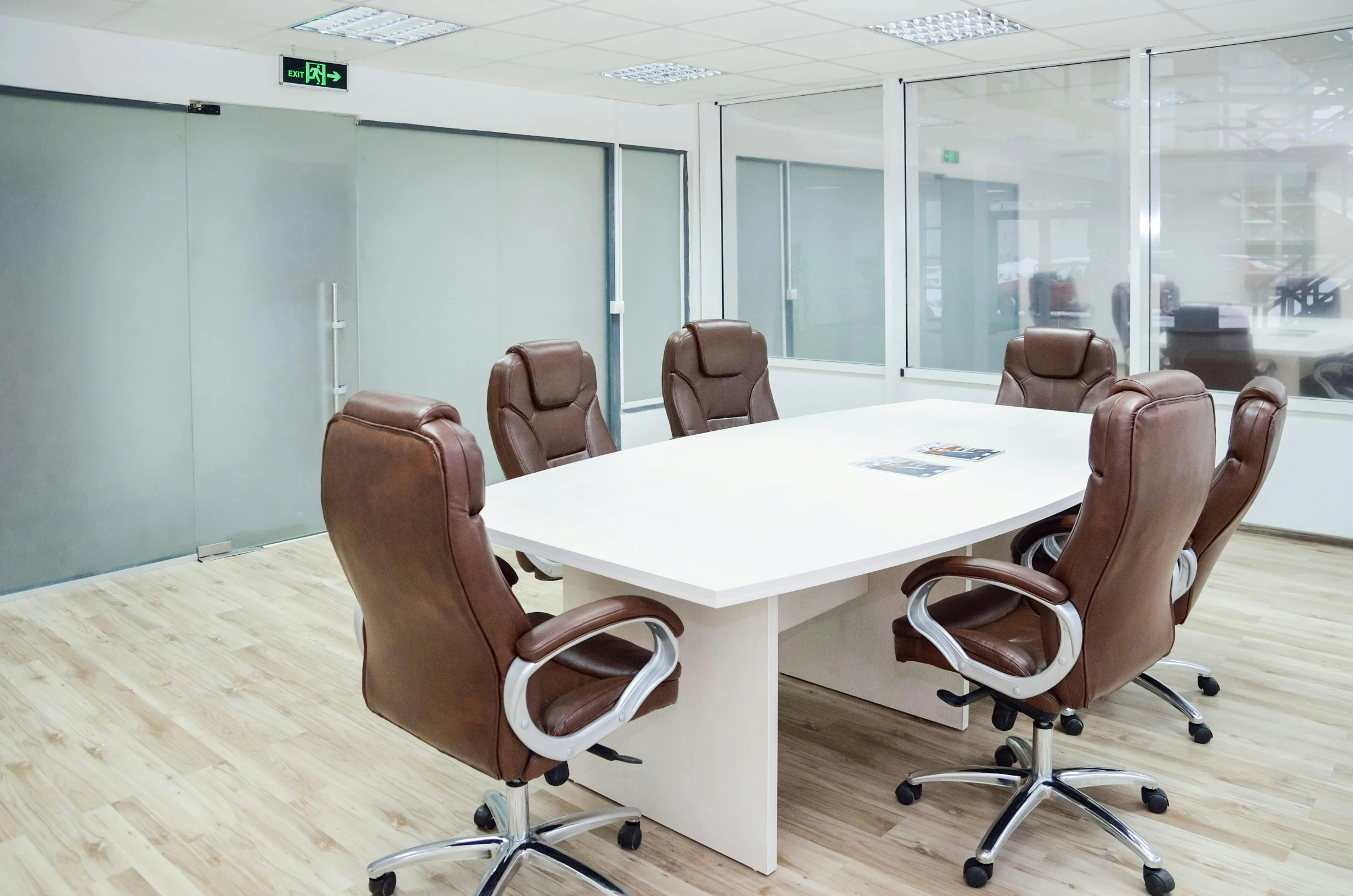 a meeting room with conference tables and chairs