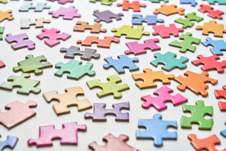 a variety of colored puzzles sitting on top of a table