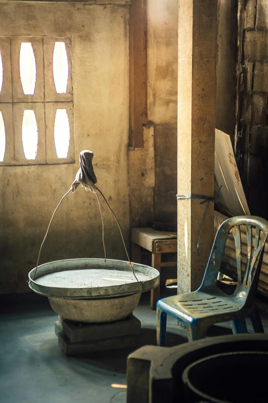 the room has an old fashioned bathtub and two chairs in it