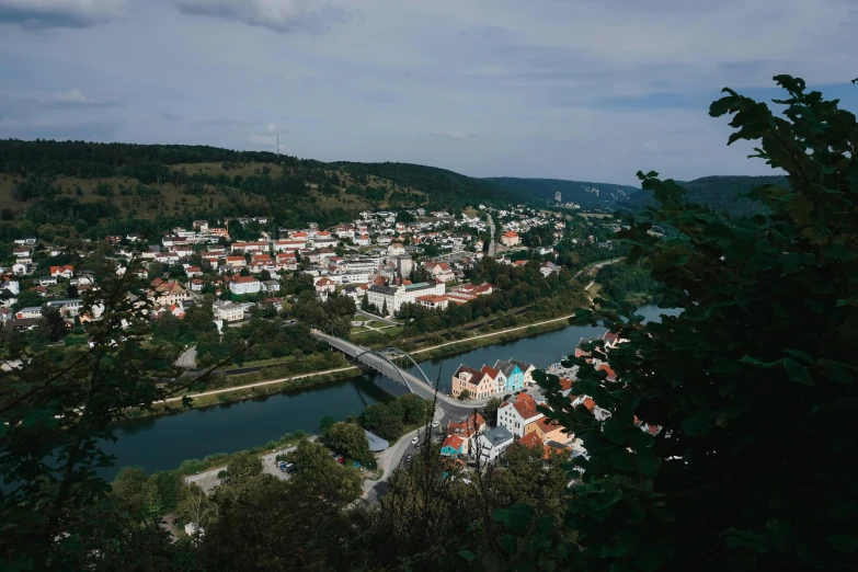 a city in a hilly area with a river