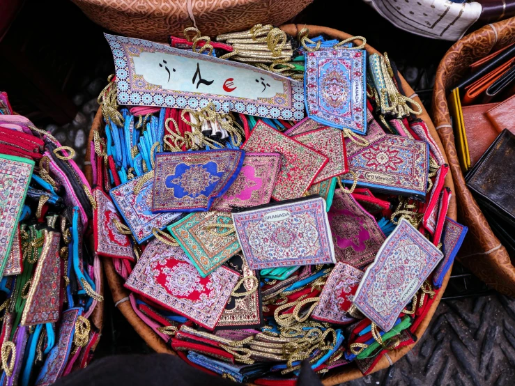 a bunch of different kinds of fabrics in a basket