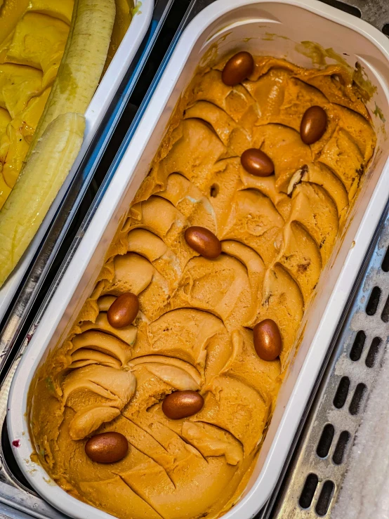 a cake in a pan with almonds on it