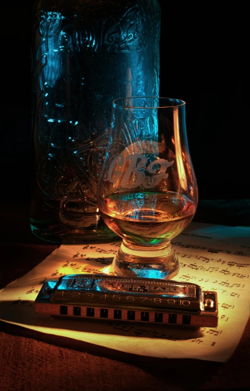 an old fashioned train is sitting on top of a paper and glass