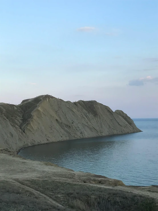 the sandy beach is empty of people or animals