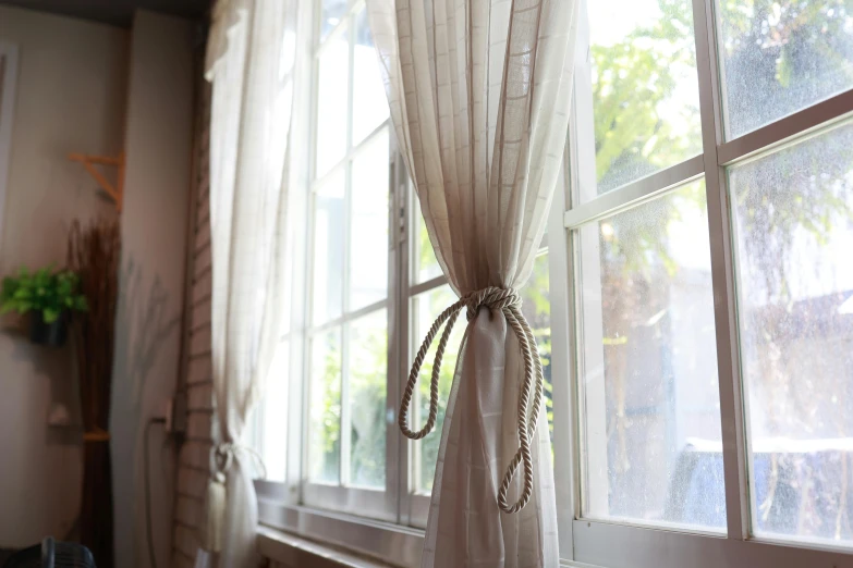 a curtain in a room with curtains behind it