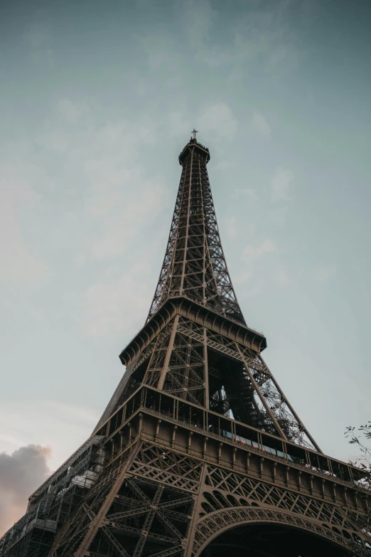 view looking up at the eiffel tower on a sunny day