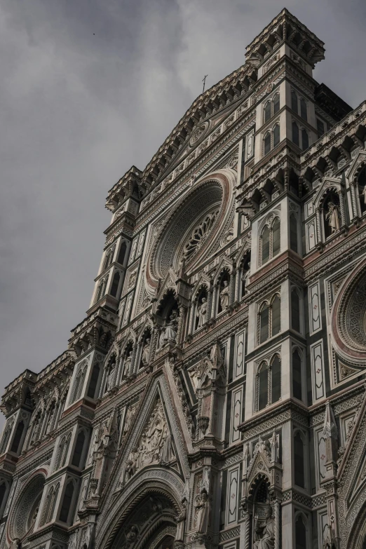 an ornate church with clock on it's face