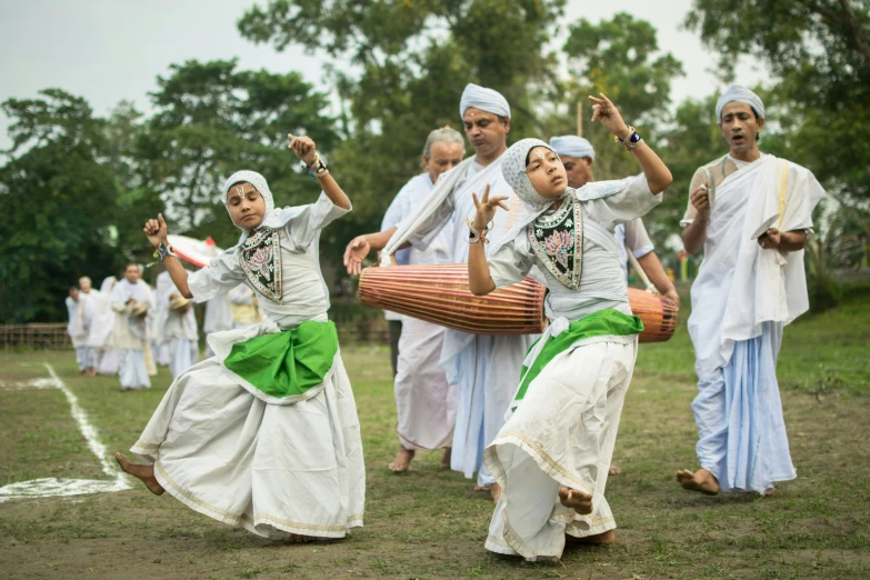 group of indian women perform a traditional dance