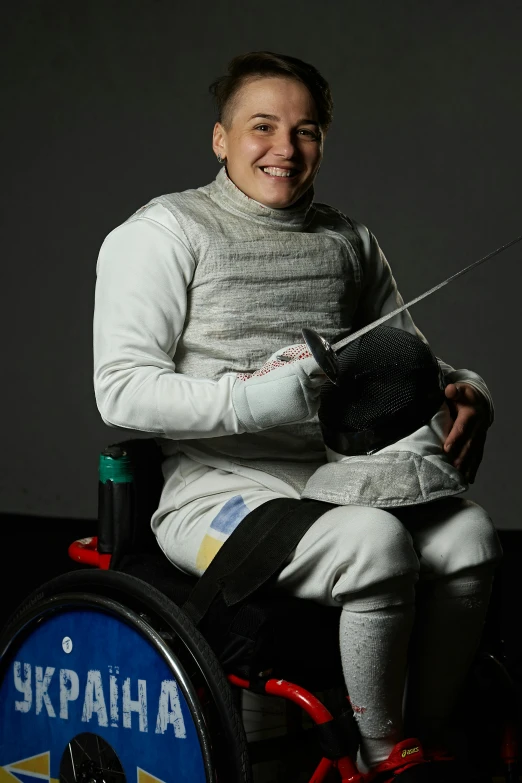 woman sitting on a wheelchair while holding a string