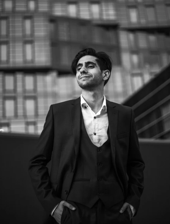 the young man is wearing a suit and bow tie