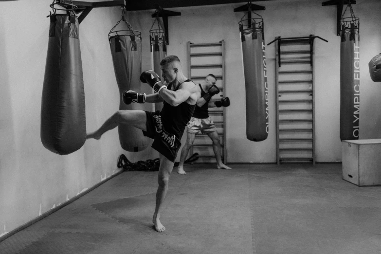 two men are in the ring on a kickbox