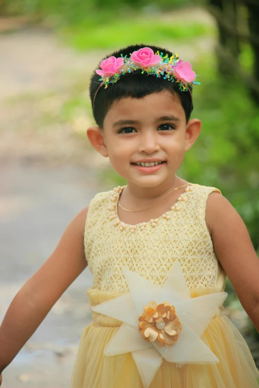 a  wearing a flowered dress posing for a picture