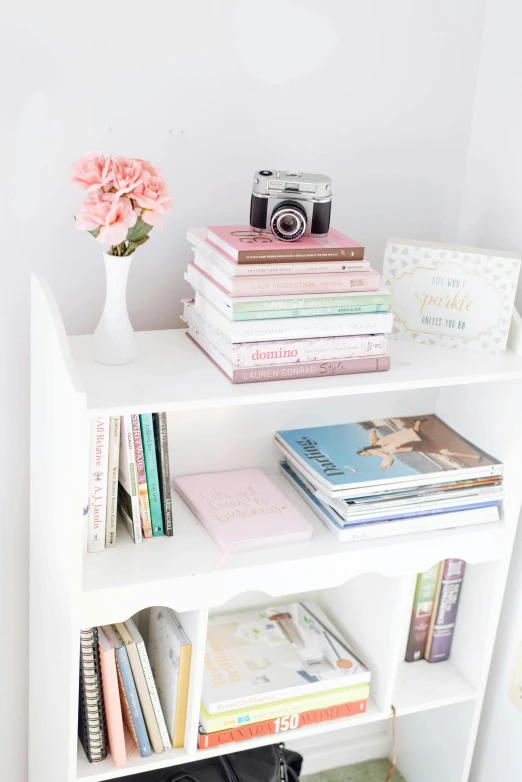 the books are piled up on the bookcase