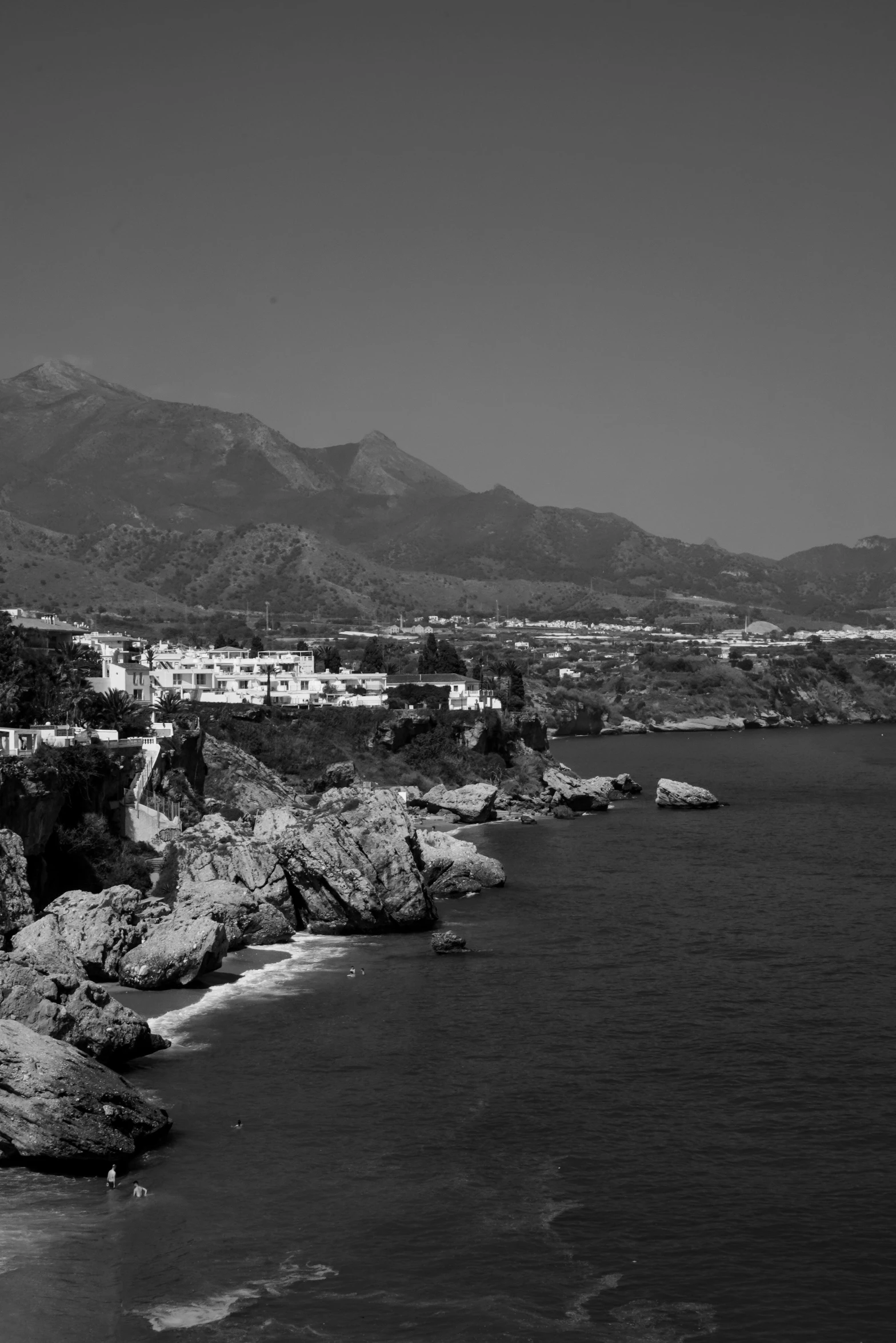 view of the shoreline and cliffs from across the ocean