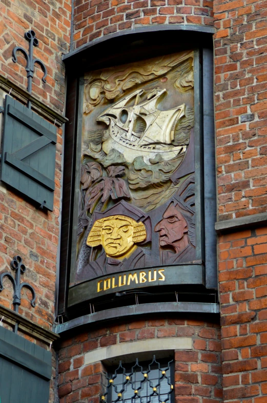 a brick building with a sign painted onto the side