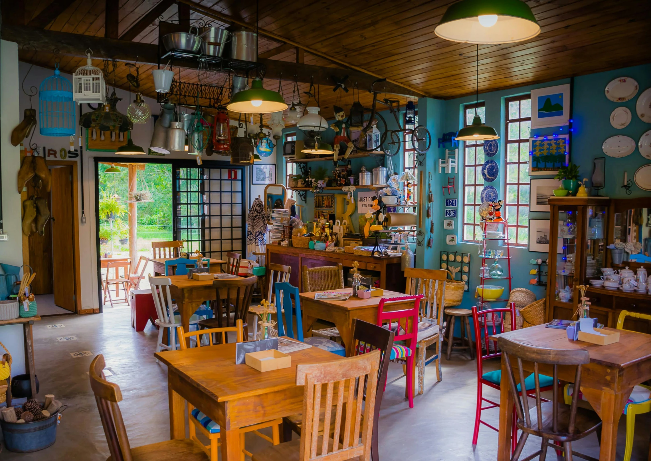 a room full of chairs and tables next to a door