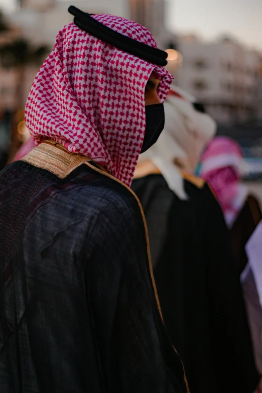 two men dressed up in costumes looking down