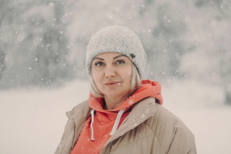 a woman in winter clothes posing for a po