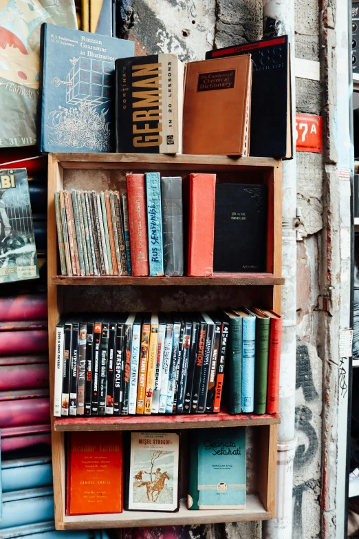 a wooden shelf filled with lots of books