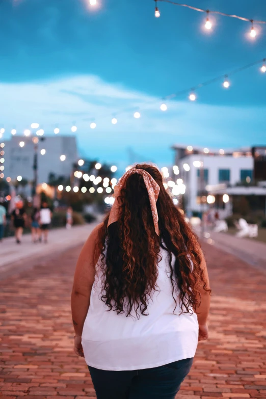 woman looking to the sky with her head in her hands