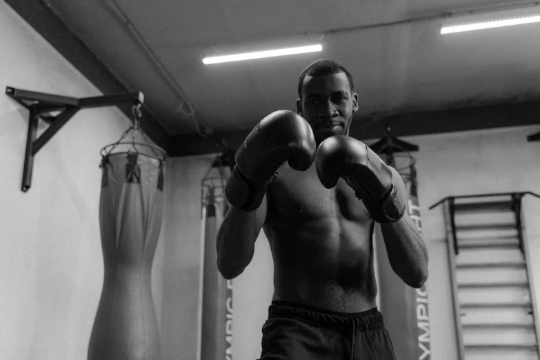 black and white image of a man with gloves on