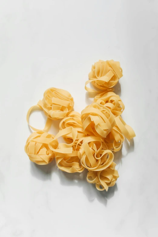 a group of several pasta noodles sitting on a white counter
