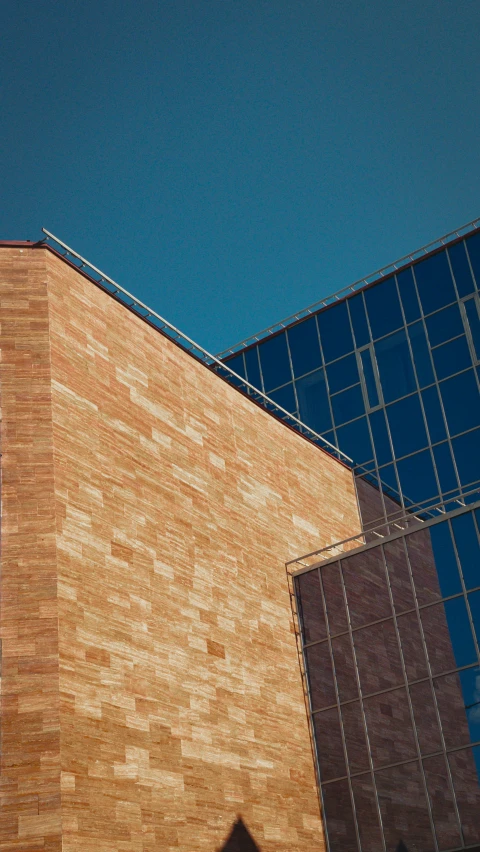 a building with some windows and a brick wall